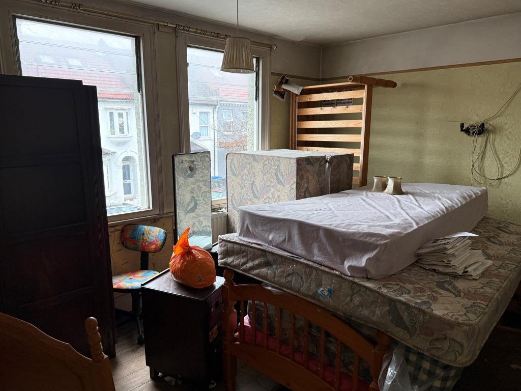 Lot: 168 - HOUSE IN NEED OF REFURBISHMENT - Front bedroom with view of road on first floor